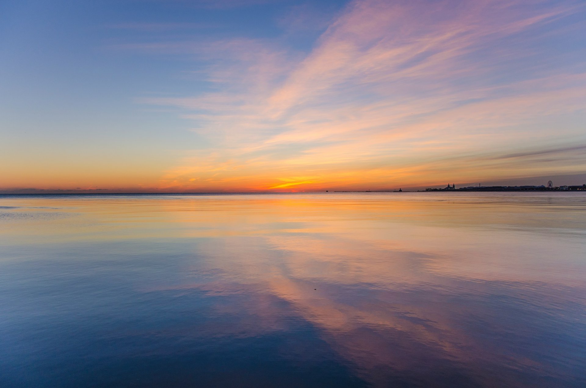 Sunrise over calm water